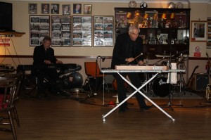 Colin Bray (piano) changes to Xylerphone and Lord Arsenal (Alan Bradley) swaps to piano with Laurie Chescoe's Reunion Band at Farnborough Jazz Club on 14th November 2014. Photo by Mike Witt.