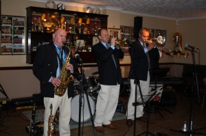 Mardi Gras Band's front line, (LtoR)s John Elmer (cl), Leigh Henson (trp) and Rob Pierce (Leader & trb) at Farnborough Jazz Club, Kent, UK on 7th November 2014. Literally so much dancing, just like the song. Photo by Mike Witt.