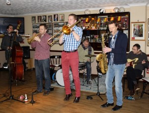 Martyn Bothers play Hot Jazz at at Farnborough Jazz Club, 6th February 2015. With Ben Martyn (d bass &vocs) Emile Martyn (drums), Allen Beechey (trumpet), George Simmons (tombone), Julian Webstr Greaves (sax) & John Ruscoe (guitar). Photo by Mike Witt.