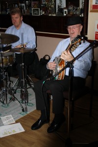 Tony Pitt (banjo) and John Tyson (drums), two of Barry Palser's Super Six at Farnborough Jazz Club on 27 February 2015. Photo by Mike Witt.