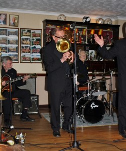Dave Hewitt (baratone horn), accompanied by Jim Douglas (guitar) and Laurie (drums) in Laurie Chescoe's Reunion Band at Farnborough Jazz Club, Kent 20th March 2015. Photo by Mike Witt.