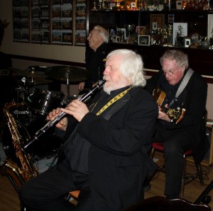 John Lee (sax), Laurie (drums) & Pete Skivington (bass) in Laurie Chescoe's Reunion Band at Farnborough Jazz Club, Kent 20March 2015. Photo by Mike Witt.