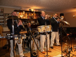 Mardi Gras Jazz Band, LtoR: John Elmer (Reeds & things), Brian Bell (drums), Leigh Henson (trumpet), Rob Pearce (trombone) at Farnborough Jazz Club, Kent, 10th April 2015. Photo by Mike Witt