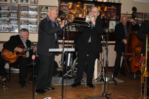 Millenium Eagle Jazz Band with (LtoR) Jim Douglas (guitar), Terry Williams (trombone), Peter Brown (trumpet) & Brian Lawrence (d bass) at Farnborough Jazz Club on 15th May 2016. Photo by Mike Witt.