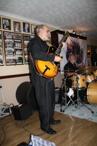 John Stewart plays guitar with Phoenix Dixieland Jazz Band at Farnborough Jazz Club (Kent) on 5th June 2015. Photo by Mike Witt.