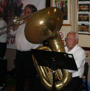 Graham Wiseman (trombone) and John Arthy (tuba), just two of the eight musicians in the 'Yerba Buena Celebration Jazz Band' seen here at Farnborough Jazz Club (Kent) on 26th June 2016. Photo by Mike Witt.