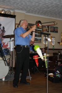 Our George 'Kid' Tidiman plays trombone with his 'All Stars' at Farnborough Jazz Club on 31st July 2015. Photo by Mike Witt.