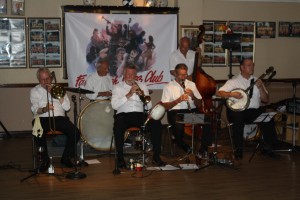 Golden Eagle Jazz Band at Farnborough Jazz Club (Kent) on 17th July 2015. (LtoR) Roy Stokes (trombone), Pete Jackman (drums), Mike Scroxton (trumpet), Alan Cresswell (clarinet), Mike Broad (double bass) and Kevin Scott (tenor banjo). Photo by Mike Witt.