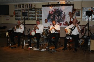 Golden Eagle Jazz Band at Farnborough Jazz Club on 17th July 2015. (LtoR) Roy Stokes (trombone), Mike Scroxton (trumpet), Pete Jackman (drums), Alan Cresswell (clarinet), Mike Broad (double bass) and Kevin Scott (tenor banjo). Photo by Mike Witt.