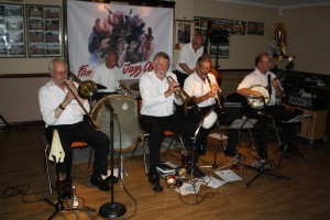Golden Eagle Jazz Band at Farnborough Jazz Club on 17th July 2015. (LtoR) Roy Stokes (trombone), Pete Jackman (drums), Mike Scroxton (trumpet), Alan Cresswell (clarinet), Mike Broad (double bass) and Kevin Scott (tenor banjo). Photo by Mike Witt.