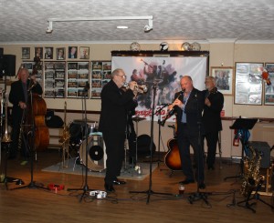 Millenium Eagle Jazz Band at Farnborough Jazz Club (Kent) on 24th July 2015. (LtoR) Brian Lawrence (double bass), Peter Brown (trumpet), Matt Palmer (band leader and clarinet) and Dave Moorwood (banjo). Missing from photo: Terry Williams (trombone) and Julyan 'Baby Jools' Aldridge (drums). Photo by Mike Witt.