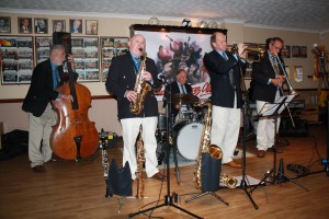 Mardi Gras Jazz Band at Farnborough Jazz Club on 21st August 2015. (LtoR) Dave Silk on d.bass, John Elmer on alto sax, Brian Bell on drums, Leigh Henson on trumpet, Rob Pierce on trombone and (not pictured) Tim Husskison on piano. Photo by Mike Witt.