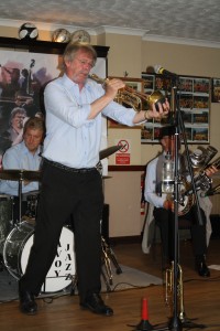Allan 'Lord Arsenal' Bradley, trumpeter, one of Barry Palser's Super Six at Farnborough Jazz Club, Kent on 19jun2015. Photo by Mike Witt.