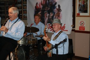 John Crocker (clarinet), Tony Pitt (banjo) and John Tyson (drums) - three of Barry Palser's Super Six at Farnborough Jazz Club, Kent on 11Sep2015. Photo by Mike Witt.