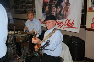 Tony Pitt,(banjo) & John Tyson (drums),, two of Barry Palser's Super Six at Farnborough Jazz Club, Kent 19June2015, Photo by Mike Witt.