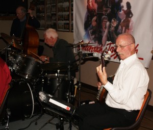 Bill Phelan's 'engine' to his band 'Bill Phelan's Muscrat Ramblers' seen here at Farnborough Jazz Club (Kent) on Friday, 2nd October 2015. (LtoR) Andy Lawrence (double bass), Paul Norman (drums) and Jim Heath (banjo&vocals). Photo by Mike Witt.