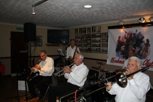 Lord Napier Hotshots play at Farnborough Jazz Club on 16th October 2015. (LtoR) Mick Scriven (d. bass & bass sax), Pat Glover (reeds), Bill Traxler (drums), Mike Jackson (trumpet), (not pictured- Lyn Saunders - banjo) and Mike Duckworth (trombone). Photo by Mike Witt.