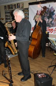 Charles Sherwood on tenor sax, backed by Roger Curphey on double bass with Phoenix Dixieland Jazz Band at Farnborough Jazz Club on 23rd October 2015. Photo by Mike Witt.