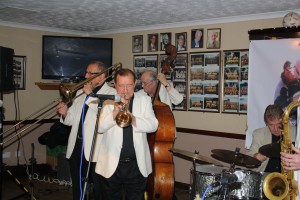 Great action photo of Dave Hewitt, Denny Ilett, Andy Laurence and John Tyson four of Tony Pitt's All Stars at Farnborough Jazz Club (Kent) on 9th October 2015. Photo by Mike Witt.