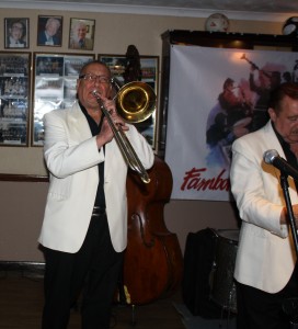 Dave Hewitt playing trombone (Denny Ilett just in view) two stars of 'Tony Pitt's All Stars' at Farnborough Jazz Club (Kent) on 9th October 2015. Photo by Mike Witt.
