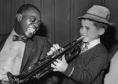 Enrico Tomasso (7years old) seen here playing for Louis Armstrong.