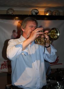 Allan 'Lord Arsenal' Bradley plays trumpet for Barry Palser's Super Six at Farnborough Jazz Club (Kent) on 12th February 2016. Photo by Mike Witt.