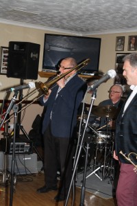 Dave Hewitt on trombone (Martin Guy (drums) & Gary Wood (trumpet) on left) with 'Jonny Boston's Hot Jazz' on tour here at Farnborough Jazz Club, 4th March 2016. Photo by Mike Witt.