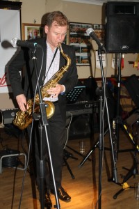 Jonny Boston plays tenor sax with his 'Jonny Boston's Hot Jazz' on tour at Farnborough Jazz Club, Kent, UK 4th March 2016. Photo by Mike Witt.