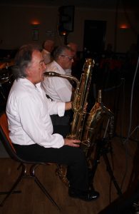 Here is the front line of the Lord Napier's Hotshots, seen playing at Farnborough Jazz Club (Kent on Friday, 26th February 2016. (LtoR) Mick Scriven joins front line on bass sax, with Pat Glover on clarinet, Mike Jackson on trumpet and Mike Duckworth on trombone. Photo by Mike Witt.