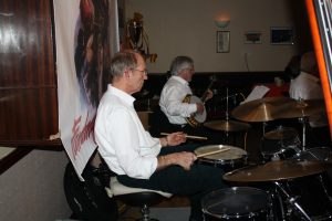 Bill Traxler on drums and Lynn Sauders on banjo play for Lord Napier Hotshots at Farnborough Jazz Club (Kent) on 26th February 2016. Photo by Mike Witt.