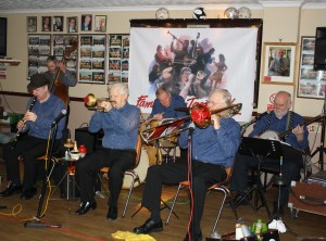 Mahogany Hall Stompers led by Brian Gyles (trumpet), with Tim Huskisson (clarinet), George 'Kid' Tidiman (trombone & vocals), Roger Curphey (d.bass), Chris Marchant (drums) and 'Southend Bob' Albutt (banjo & vocals). Photo by Mike Witt.