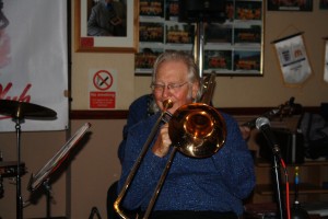 Super photo of George 'Kid' Tidiman on trombone with Mahogany Hall Stompers at Farnborough Jazz Club (Kent) on 5th February 2016. Photo by Mike Witt