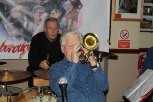 Brian Gyles, trumpeter and band leader of Mahogany Hall Stompes with Chris Marchant on drums at Farnborough Jazz Club (Kent) on 5th February 2016. Photo by Mike Witt.
