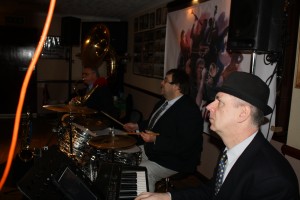 'Engine' of Mardi Gras JazzBand at Farnborough Jazz Club (Kent) on 19th February 2016. (LtoR) Marc Easener (sousaphone), Paul Baker (drums) and Tim Huskisson (piano). Photo by Mike Witt.
