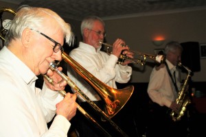 Bob Dwyer on trombone, Tony O'Sullivan on trumpet and Bernie Holden on alto sax front line of Bob Dwyer's Bix &Pieces playing at Farnborough Jazz Club on 18mar2016. Photo by Mike Witt.