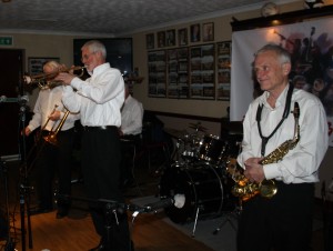 Tony Tony O'Sullivan plays trumpet with Bob Dwyer (just hidden) and Bernie Holden with Bob Dwyer's Bix &Pieces at Farnborough Jazz Club 18th March 2016. Photo by Mike Witt.