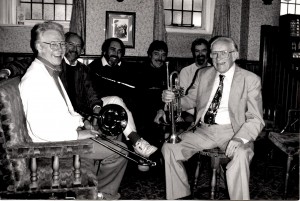 The Bill Brunskill’s New Orleans Jazz Band. Lovely photo of (LtoR) George 'Kid' Tidiman (trombone), Phil Durell (banjo), Graham Wiseman (d.bass/tuba), Pete Lay (drums), George Berry (clarinet) and Bill Brunskill (trumpet). Taken at the pub next door to a recording studio where they had a recording session [wonder what was recorded!] Circa 1993. Photo provided by Barbara Chadwick & Stephen Moyse.