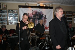 Laurie Chescoe's Reunion Band at Farnborough Jazz Club (Kent) on 22nd April 2016. (LtoR) Jim Douglas (guitar), Mike Pointon (trombone), Laurie Chescoe (drums), Allan 'Lord Arsenal' Bradley (trumpet) & Pete Skivington (bass guitar). Photo by Mike Witt.