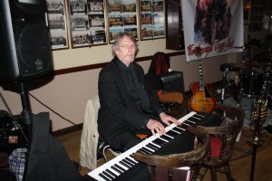 Allan 'Lord Arsenal' Bradley swops with Colin Bray and plays piano with Laurie Chescoe's Reunion Band at Farnborough Jazz Club (Kent) on 22nd April 2016. Photo by Mike Witt.