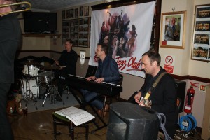 Part engine of Martyn Brothers at Farnborough Jazz Club (Kent) on 15th April 2016. John flashback radio' Ruscoe (guitar), Ian Beetlestone (piano) and Dominique Coles (drums). Photo by Mike Witt.