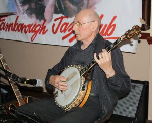 Johnny McCallum plays banjo for 'Bill Phelan's Muscrat Ramblers' at Farnborough Jazz Club on 27th May 2016. Photo by Mike Witt.