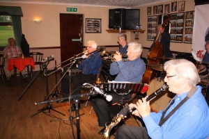 Mahogany Hall Stompers at Farnborough Jazz Club (Kent) on 20th May 2016. (LtoR) Colin Graham (trombone), Tim Huskisson (piano), Brian Gyles (trumpet&band leader), Roger Curphey (double bass) and Tony Teale (clarinet) and not in picture - Chris Marchant (drums) and 'Southend Bob' Albutt (banjo&vocals). Photo by Mike Witt.