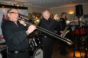 How's that for a great front line? (LtoR) Dave Hewitt (trombone), Alan Gresty (trumpet) and Al Nicholls (tenor sax) with 'Tony Pitt's All Stars' seen here at Farnborough Jazz Club (Kent) on 6th May 2016. Photo by Mike Witt.