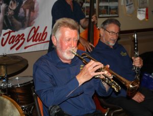 The Golden Eagle Jazz Band's trumpeter, Mike Scroxton plays whilst clarinetist, Allan Cresswell listens, at Farnborough Jazz Club (Kent) on Friday, 17th June 2016. Photo by Mike Witt.