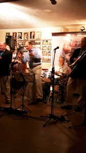 Mardi Gras JazzBand at Farnborough Jazz Club on Friday, 24th June 2016. (LtoR) John Ellmer on plenty-of-reeds, just see Steve Smith (double bass), Leigh Henson (trumpet) (Steve's father has sit-in) Pete Smith (drums), Rob Pearce (trombone). (Not seen) Paul Higgs (piano) & Paul Baker (drums). Photo by Peter Marr.