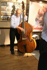 Andy Lawrence playing double bass as one of 'Barry Palser's Super Six, here at Farnborough Jazz Club (Kent) on 15th July 2016. Photo by Mike Witt.
