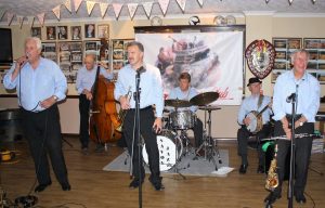 'Barry Palser's Super Six' play at Farnborough Jazz Club (Kent) on 15th July 2015. (LtoR) Barry Palser on trombone, Andy Lawrence on double bass, Gary Wood on trumpet, John Tyson on drums, Tony Pitt on drums and Goff Dubber on clarinet. Photo by Mike Witt.