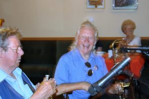 How about this photo of our beaming 'Kid', George Tidiman on trombone, seen here with Ken Simms on trumpet.  Taken at Farnborough Jazz Club (Kent) on 22nd July 2016 with his own band ;George ;Kid; Tidiman's All Stars. Photo by Mike Witt.