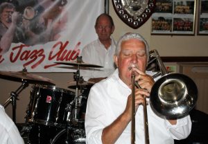 Mike Duckworth plays muted trombone accompanied by Bill Traxler on drums. Seen here playing with Lord Napier Hotshots at Farnborough Jazz Club on 29th July 2016. Photo by Mike Witt.