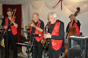 'Front liners' for Phoenix Dixieland Jazz Band. Seen here at Farnborough Jazz Club on 19th August 2016. (LtoR) Bill Todd (trombone), Mike Barry (trumpet) and Charles Sherwood (tenor sax ), plus Roger Curphey (double bass). Photo by Mike Witt.